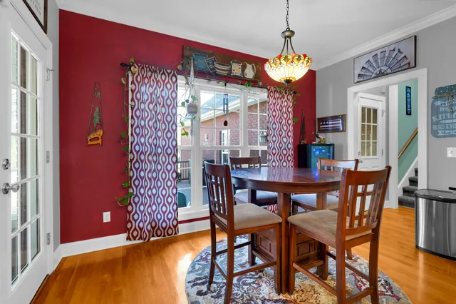 a bed sitting in a bedroom and painting on the wall