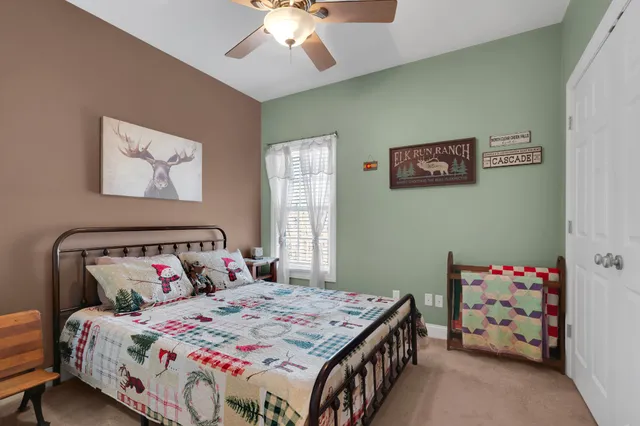 a living room with furniture and floor to ceiling windows