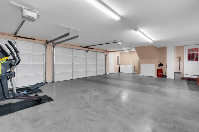 a aerial view of a house with a yard and sitting space