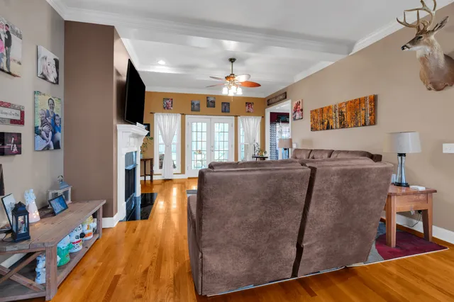 a living room with furniture and large windows