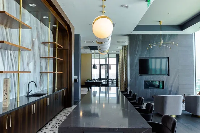 a kitchen with lots of counter space and windows