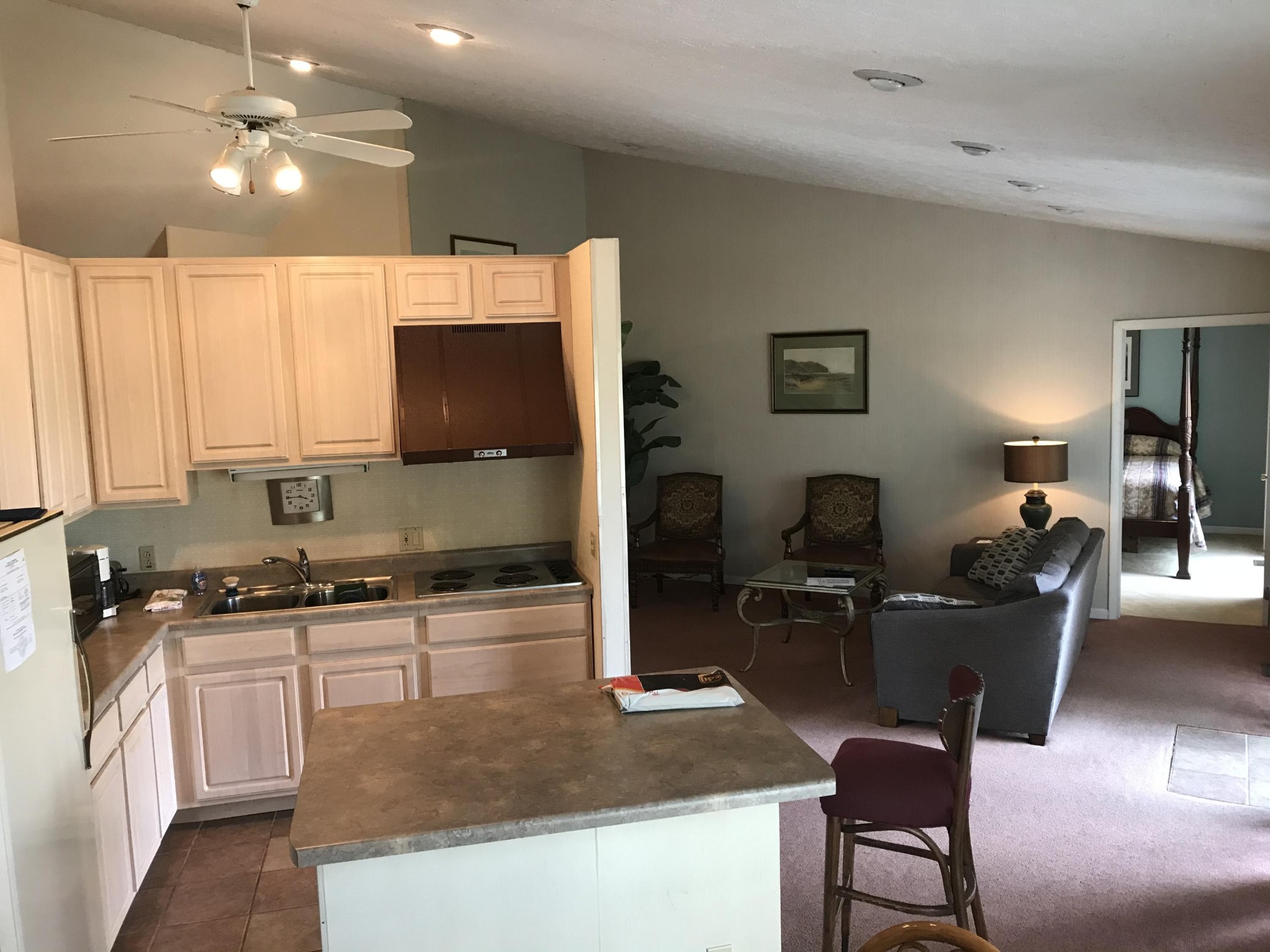 720 Harrison Ferry Road, Unit A White Pine, TN 37890 - Photo 8 of 19 a kitchen with a stove a sink a microwave a dining table and chairs
