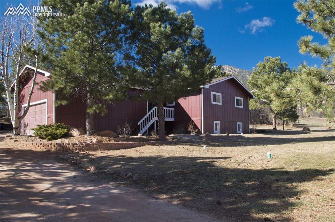 4315 Red Forest Road Monument, CO 80132 - Photo 1 of 32 front of home and garage with extra parking for guests
