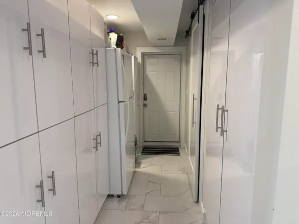 a bathroom with a shower and a glass door