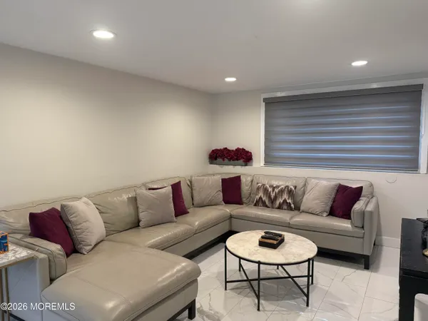 a living room with furniture and a rug