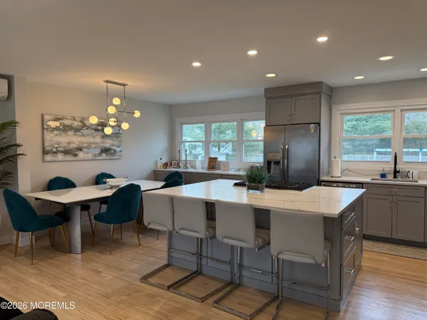 a kitchen with a table and chairs in it