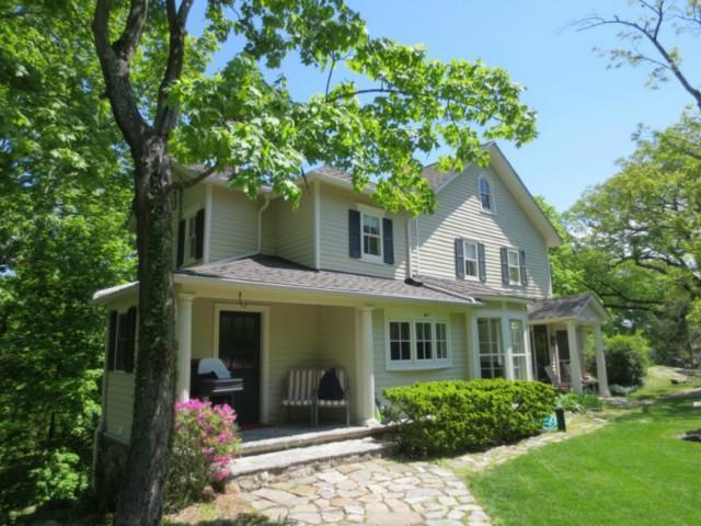 a front view of a house with a porch
