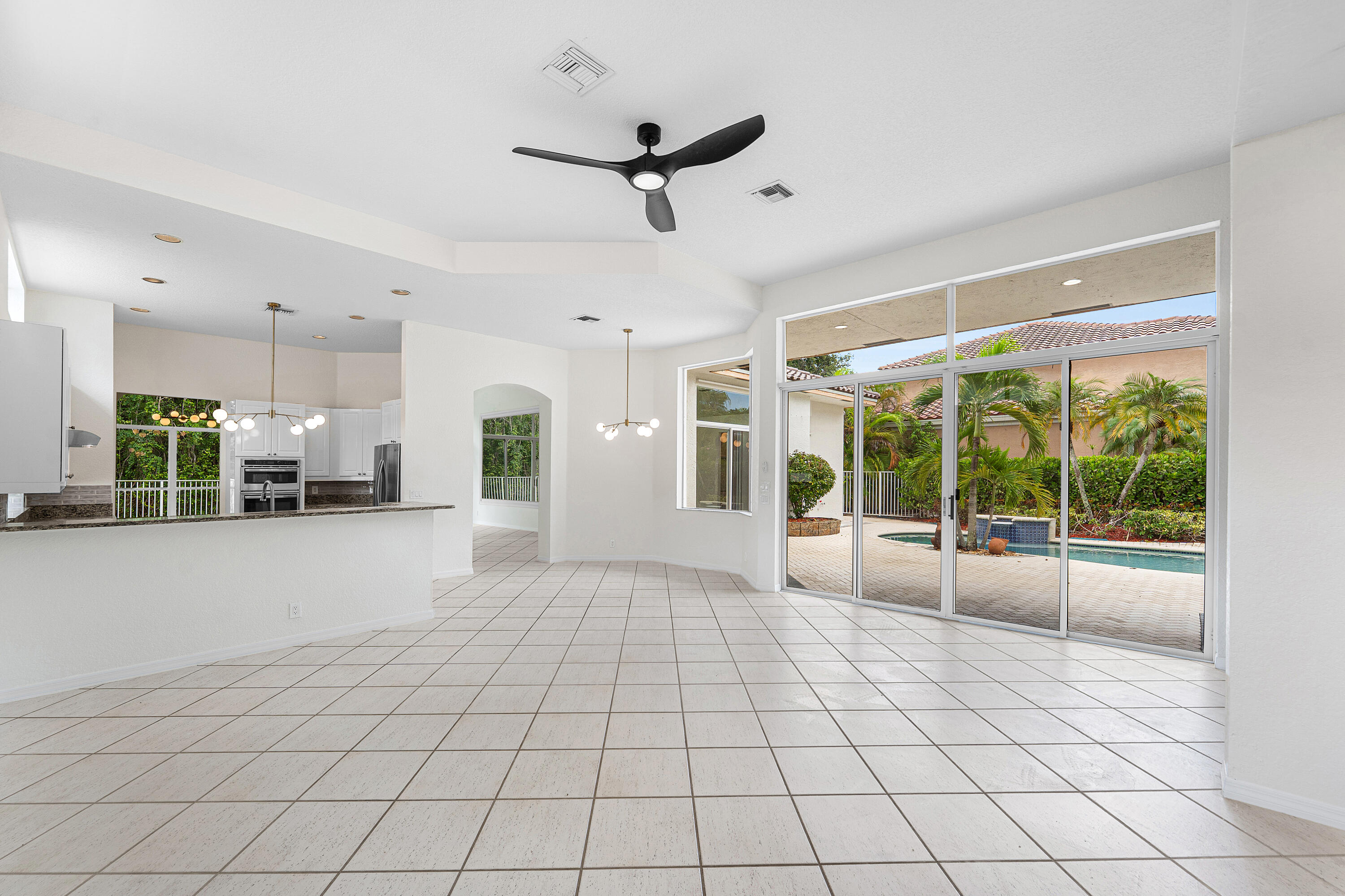 18596 Ocean Mist Drive Boca Raton, FL 33498 - Photo 21 of 51 Family Room Sliders Lead To Courtyard