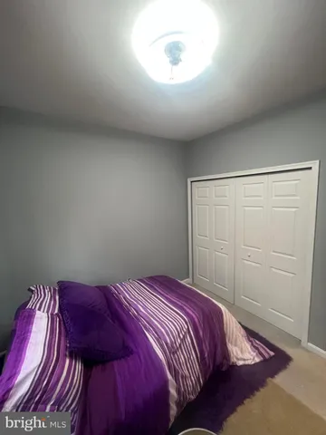 a room with a bed and a window