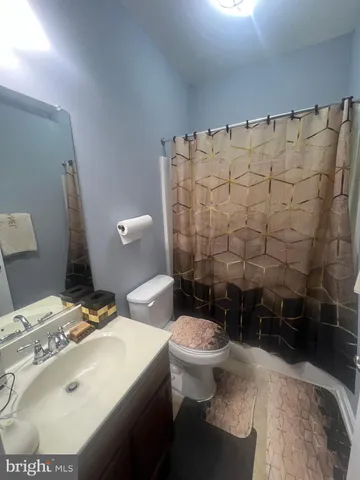 a living room with furniture and a lamp