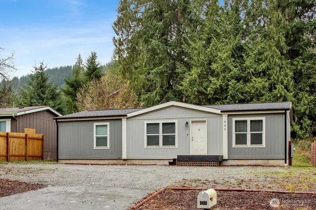 a house with trees in the background
