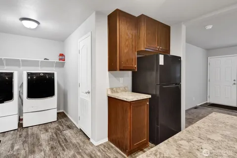 a kitchen with stainless steel appliances a refrigerator and a stove