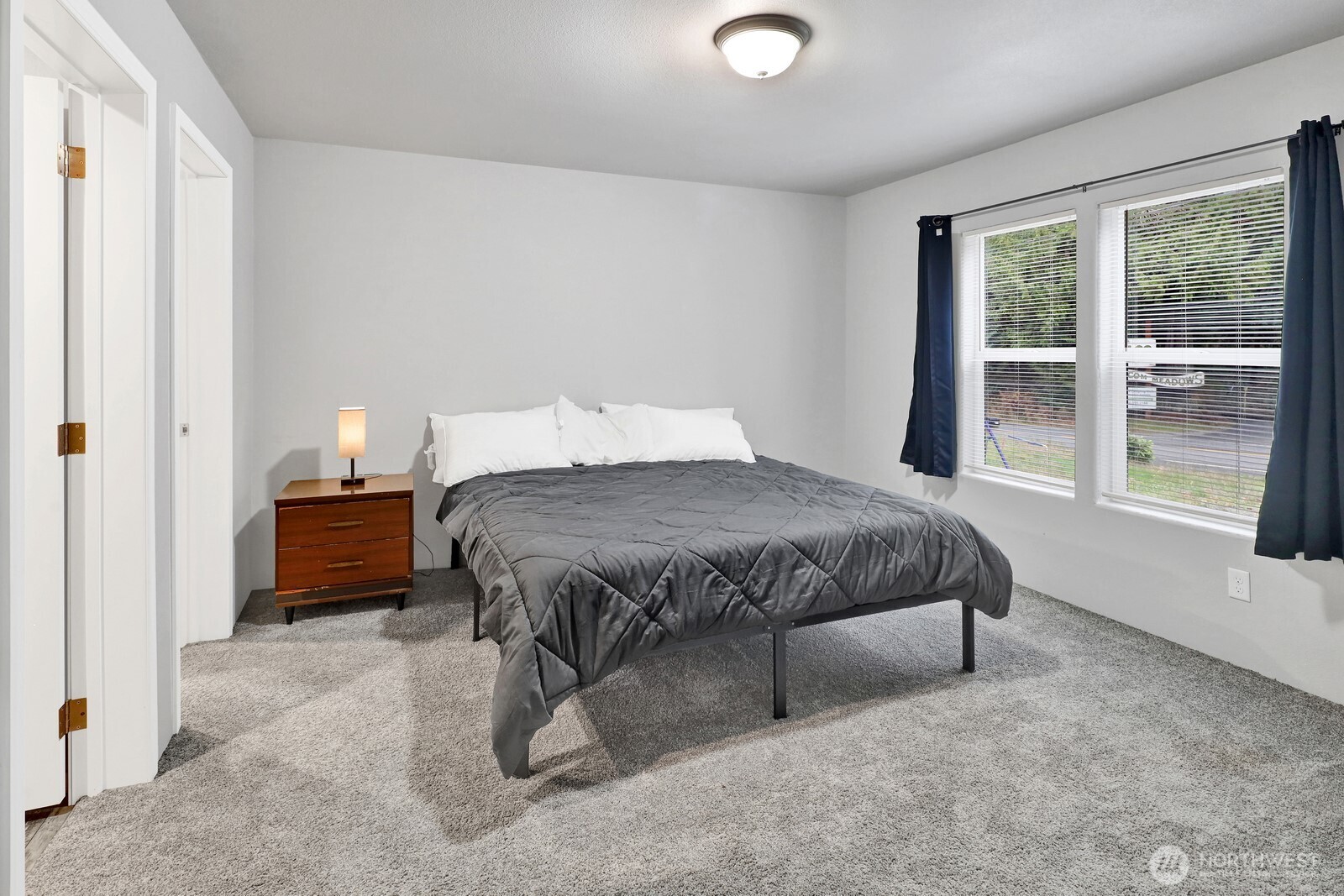 467 Cain Lake Road Sedro-Woolley, WA 98284 - Photo 16 of 28 a bedroom with a bed and a large window