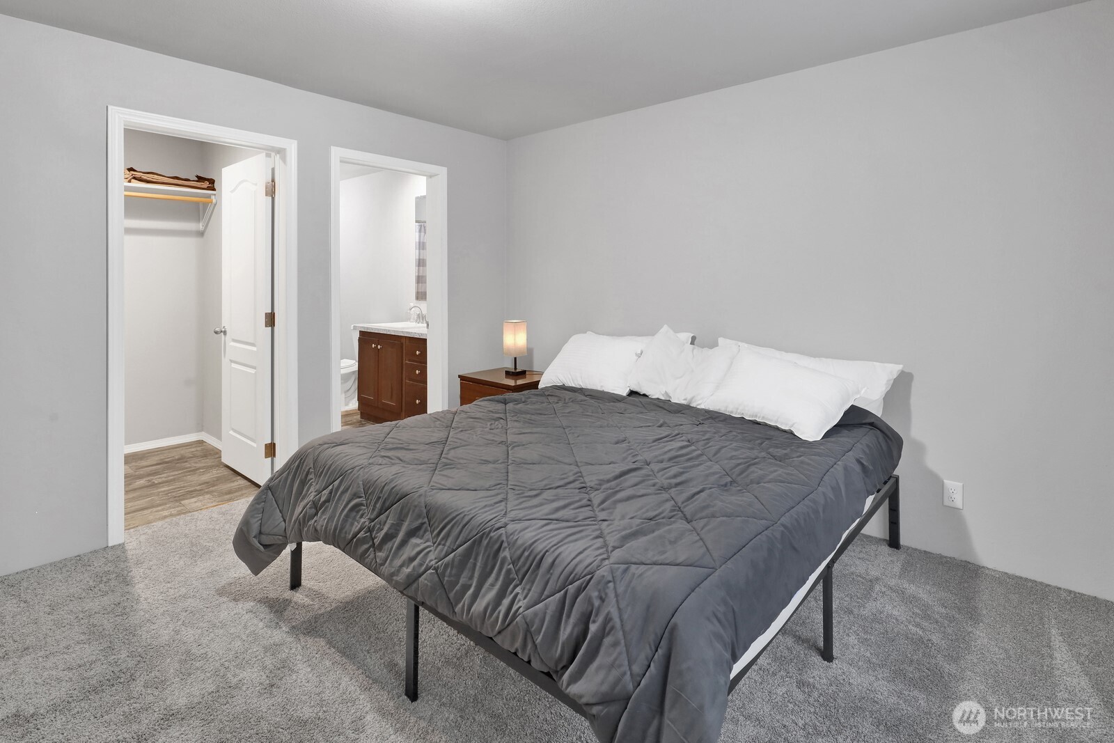 467 Cain Lake Road Sedro-Woolley, WA 98284 - Photo 17 of 28 a bedroom with a bed and lamp