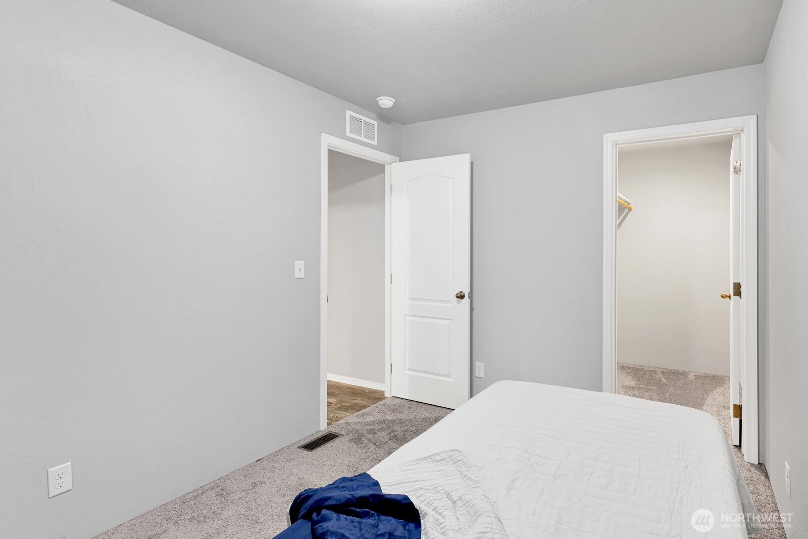 467 Cain Lake Road Sedro-Woolley, WA 98284 - Photo 24 of 28 a bedroom with a bed and a hallway