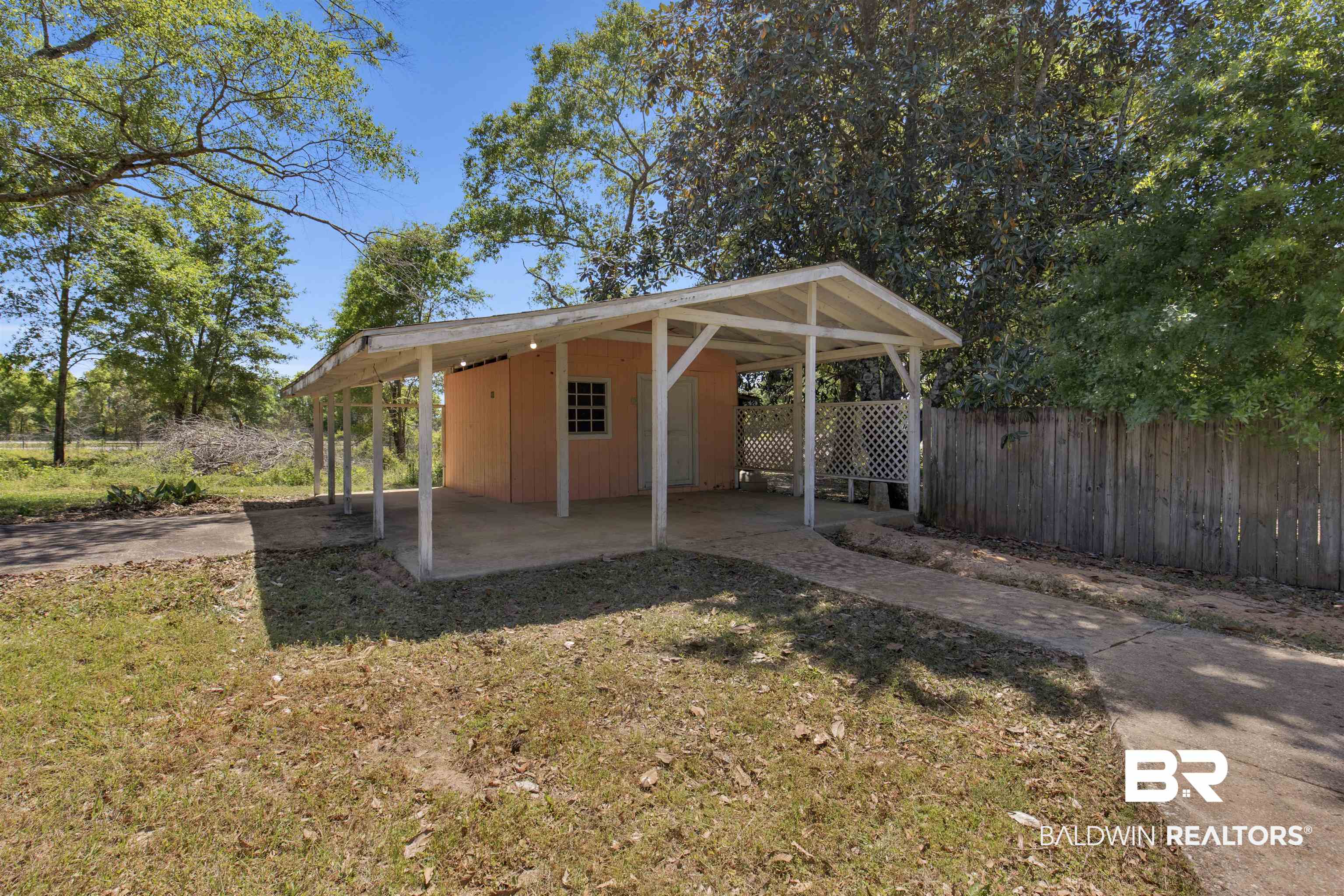 5665 Ulysses Road Eight Mile, AL 36613 - Photo 18 of 23 View of yard with fence and an outdoor structure