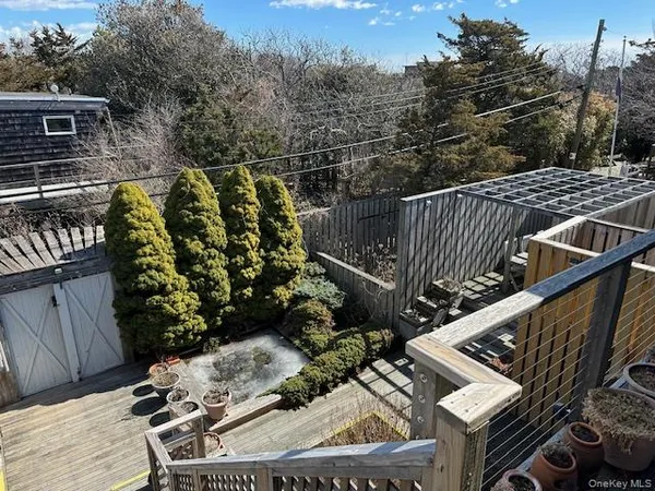 a view of balcony with wooden floor