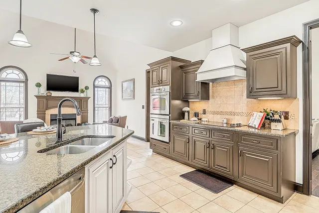 an aerial view of a house with outdoor space and lake view