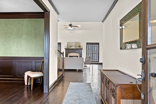 a kitchen with stainless steel appliances kitchen island granite countertop a refrigerator and cabinets
