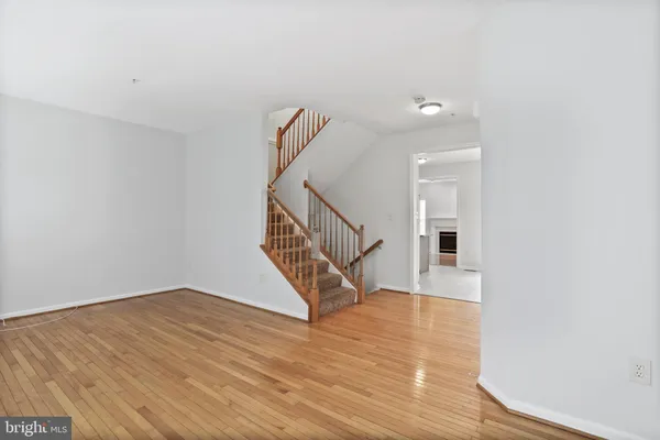 a view of an entryway with wooden floor