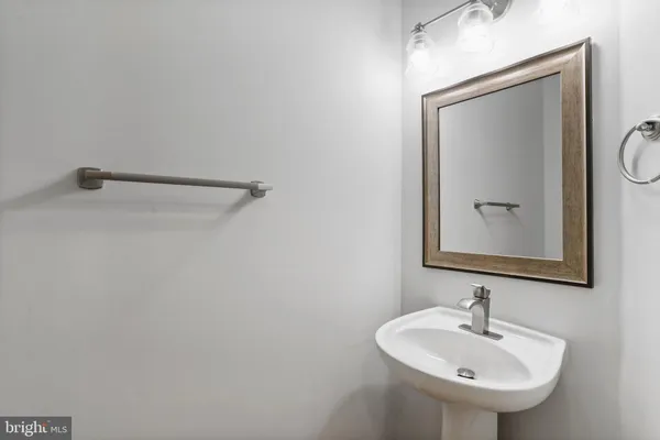 a bathroom with a sink and mirror