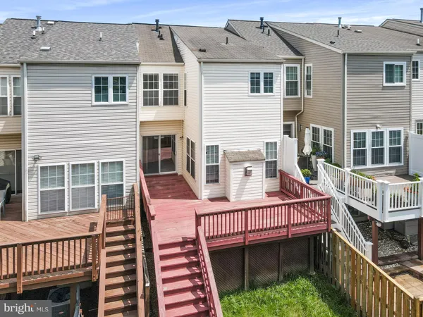 a view of a house with wooden deck