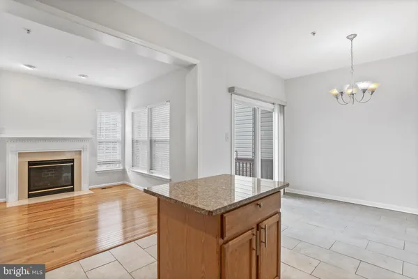 a living room with granite countertop furniture and fireplace