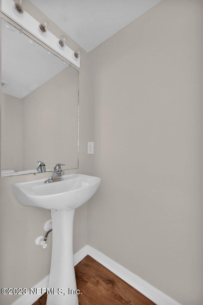 12070 Chester Creek Road Jacksonville, FL 32218 - Photo 12 of 45 a bathroom with a sink a mirror and toilet