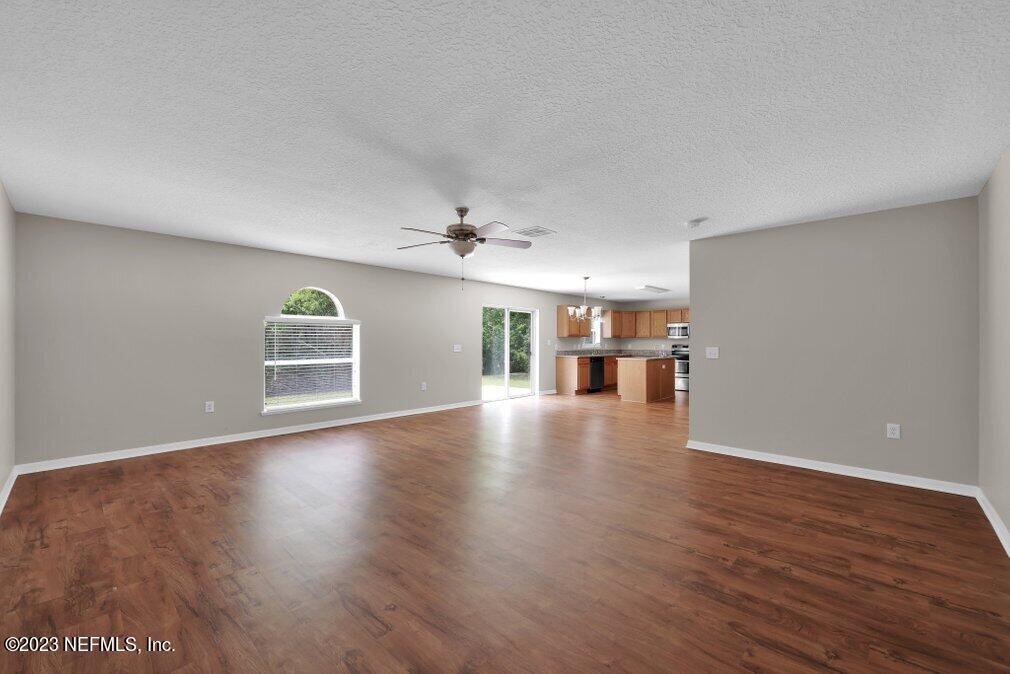 12070 Chester Creek Road Jacksonville, FL 32218 - Photo 21 of 45 a view of livingroom and hall with wooden floor