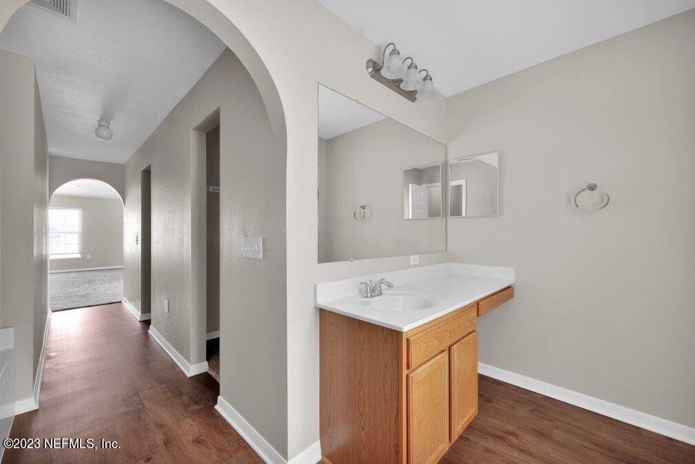12070 Chester Creek Road Jacksonville, FL 32218 - Photo 30 of 45 a view of a hallway with wooden floor