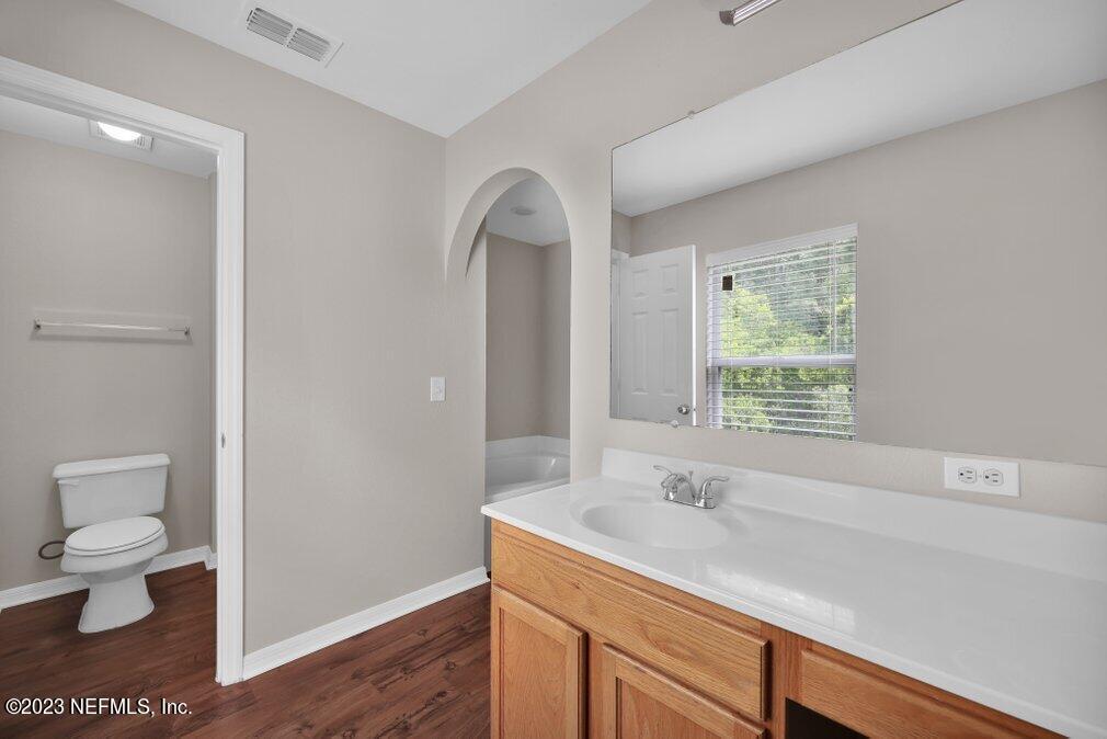 12070 Chester Creek Road Jacksonville, FL 32218 - Photo 31 of 45 a view of bathroom with a toilet sink and a window