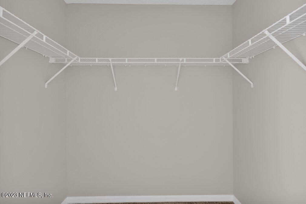 12070 Chester Creek Road Jacksonville, FL 32218 - Photo 34 of 45 a view of a room with racks on the wall