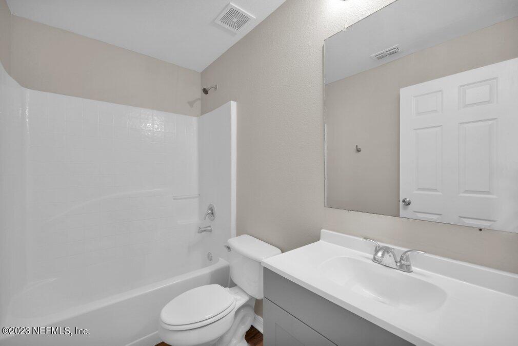 12070 Chester Creek Road Jacksonville, FL 32218 - Photo 35 of 45 a bathroom with a sink toilet and shower