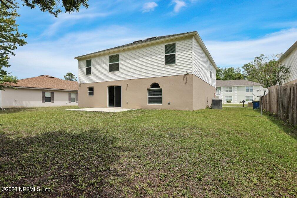 12070 Chester Creek Road Jacksonville, FL 32218 - Photo 43 of 45 a front view of a house with a garden