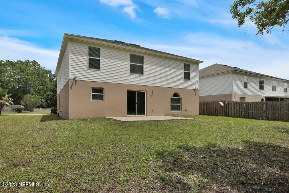 12070 Chester Creek Road Jacksonville, FL 32218 - Photo 45 of 45 a view of a yard in front of a house with a large tree