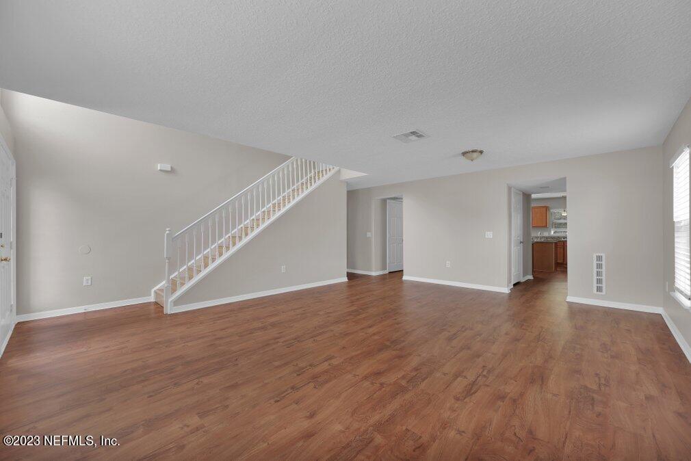 12070 Chester Creek Road Jacksonville, FL 32218 - Photo 9 of 45 a view of empty room with wooden floor