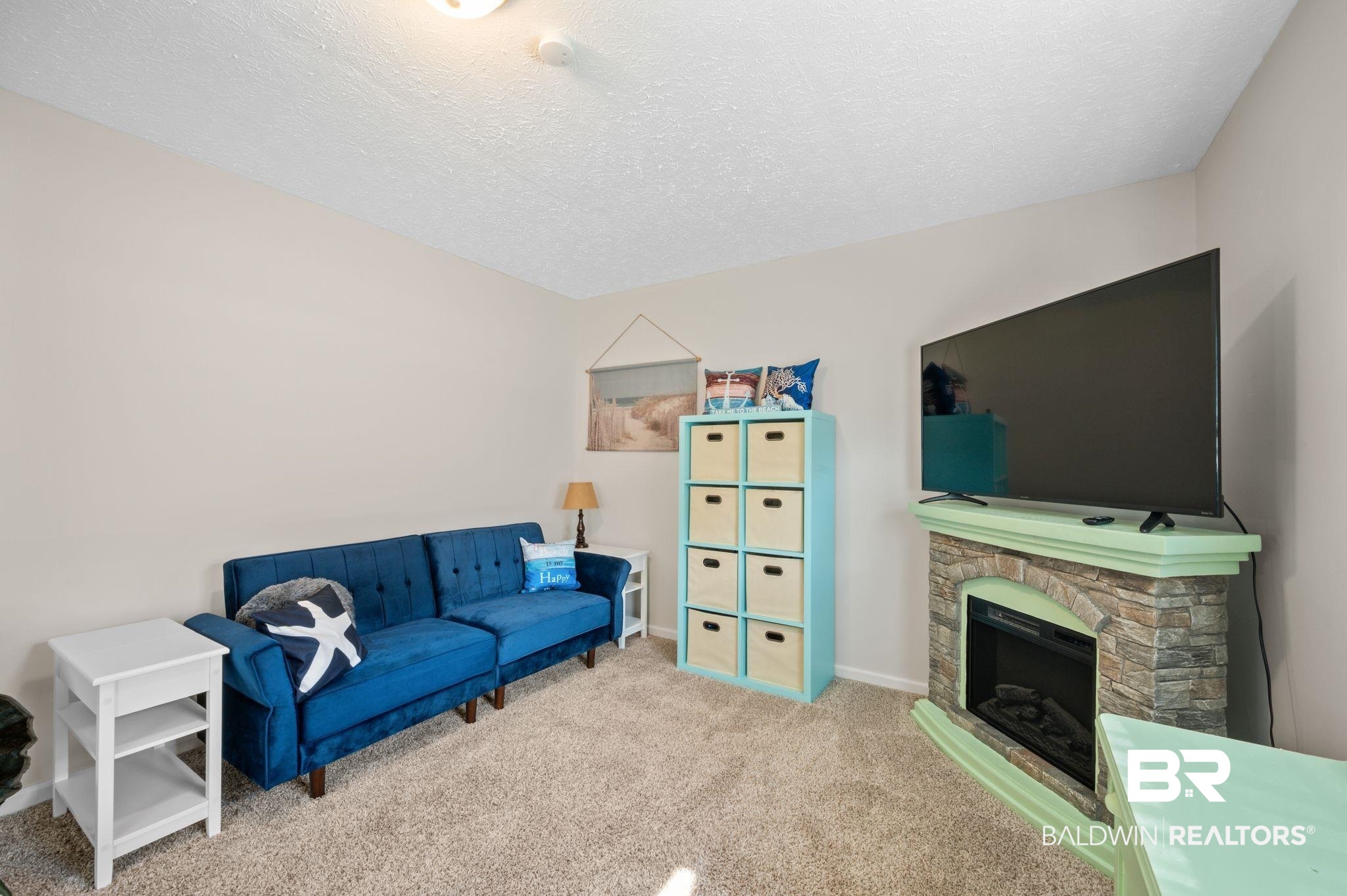 48513 Phillipsville Road Bay Minette, AL 36507 - Photo 36 of 50 Carpeted living room featuring a textured ceiling and a fireplace