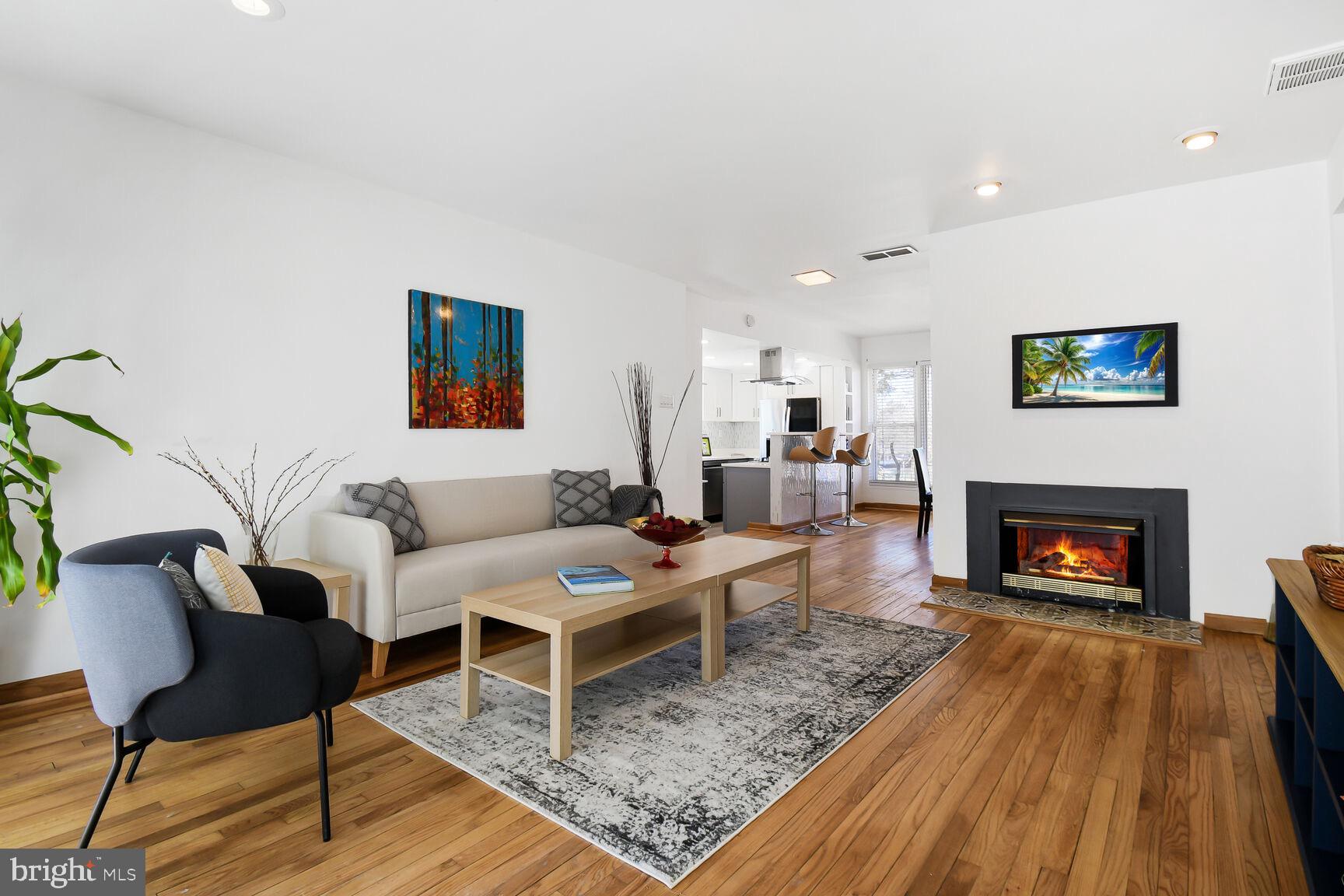 12917 Estelle Road Silver Spring, MD 20906 - Photo 6 of 28 a living room with furniture and a fireplace