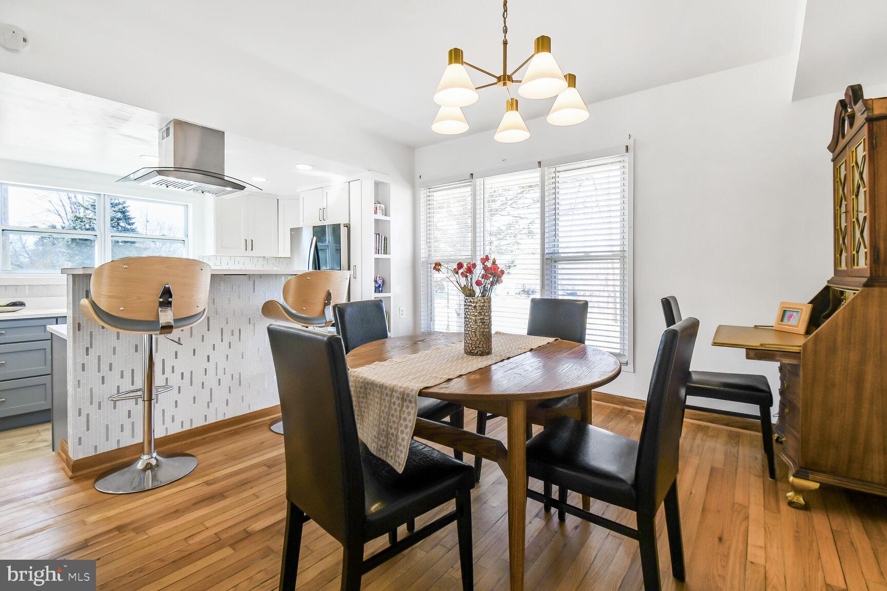 12917 Estelle Road Silver Spring, MD 20906 - Photo 10 of 28 a view of a dining room with furniture window and wooden floor