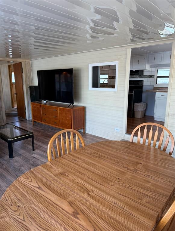 9486 Gray Fox Drive Weeki Wachee, FL 34613 - Photo 12 of 43 a living room with furniture and a flat screen tv