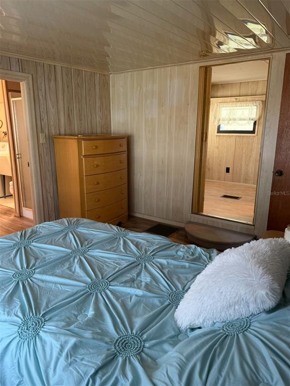 9486 Gray Fox Drive Weeki Wachee, FL 34613 - Photo 15 of 43 a bedroom with a bed and a window