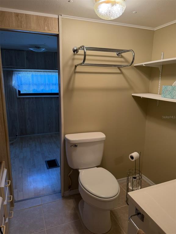9486 Gray Fox Drive Weeki Wachee, FL 34613 - Photo 17 of 43 a bathroom with a toilet and a shower