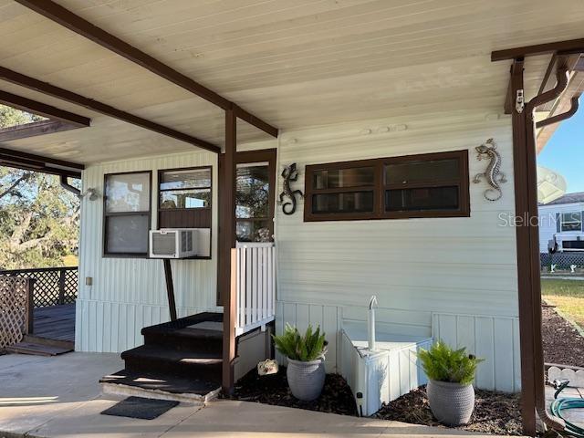 9486 Gray Fox Drive Weeki Wachee, FL 34613 - Photo 2 of 43 a potted plant sitting in front of a building