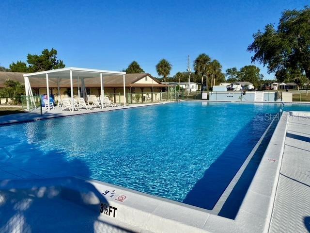 9486 Gray Fox Drive Weeki Wachee, FL 34613 - Photo 39 of 43 a view of swimming pool with outdoor seating