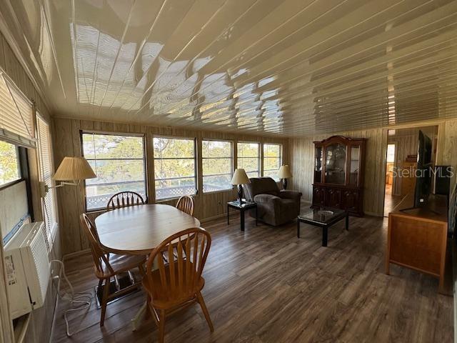 9486 Gray Fox Drive Weeki Wachee, FL 34613 - Photo 7 of 43 a dining room with furniture window wooden floor