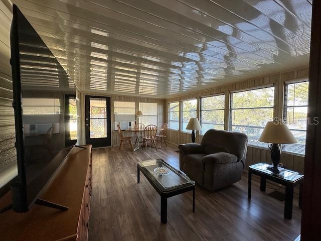 9486 Gray Fox Drive Weeki Wachee, FL 34613 - Photo 9 of 43 a living room with furniture a table and wooden floor