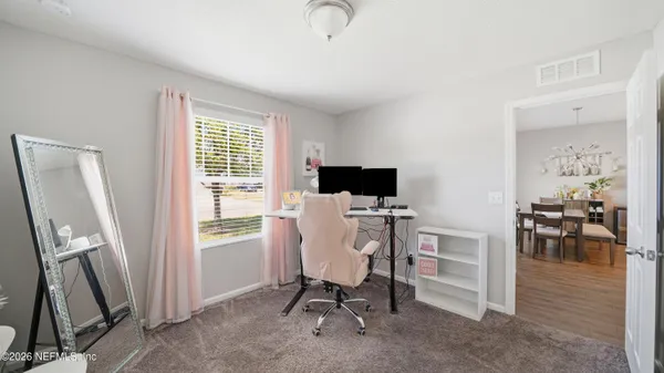 a workspace with furniture and a window