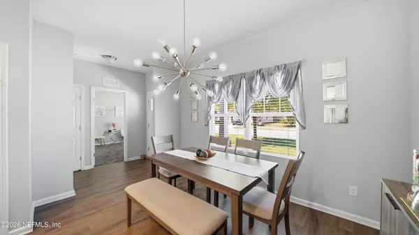 a kitchen with stainless steel appliances granite countertop a sink a stove and refrigerator