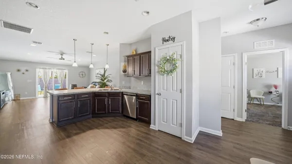 a kitchen with a sink a stove and cabinets