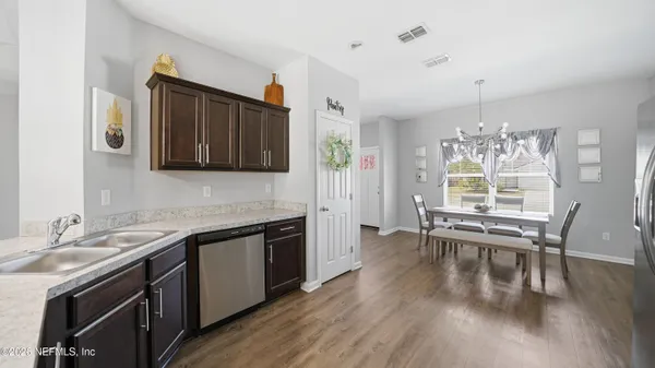 a kitchen with stainless steel appliances granite countertop a sink stove and oven